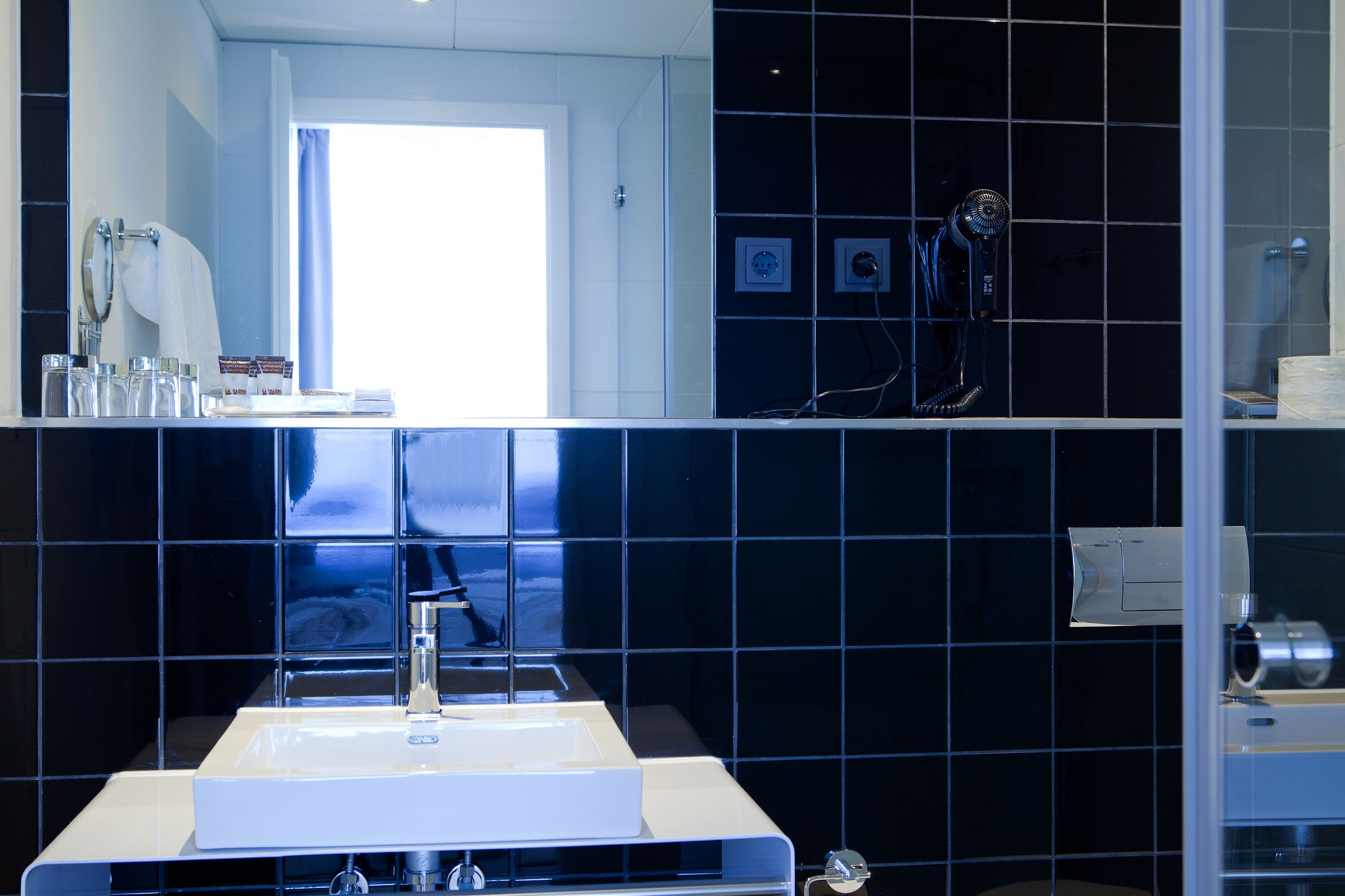 shower, eco-friendly toiletries, hair dryer, towels