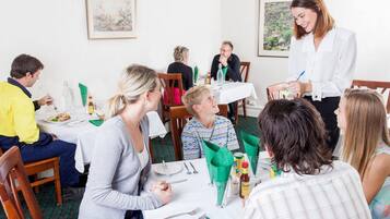 Breakfast, lunch, dinner served; local cuisine