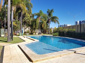 Outdoor pool, pool umbrellas, sun loungers