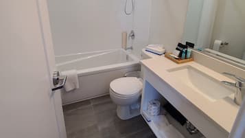 Single Room, 1 King Bed, Refrigerator & Microwave | Bathroom | Combined shower/bathtub, rainfall showerhead, free toiletries, towels