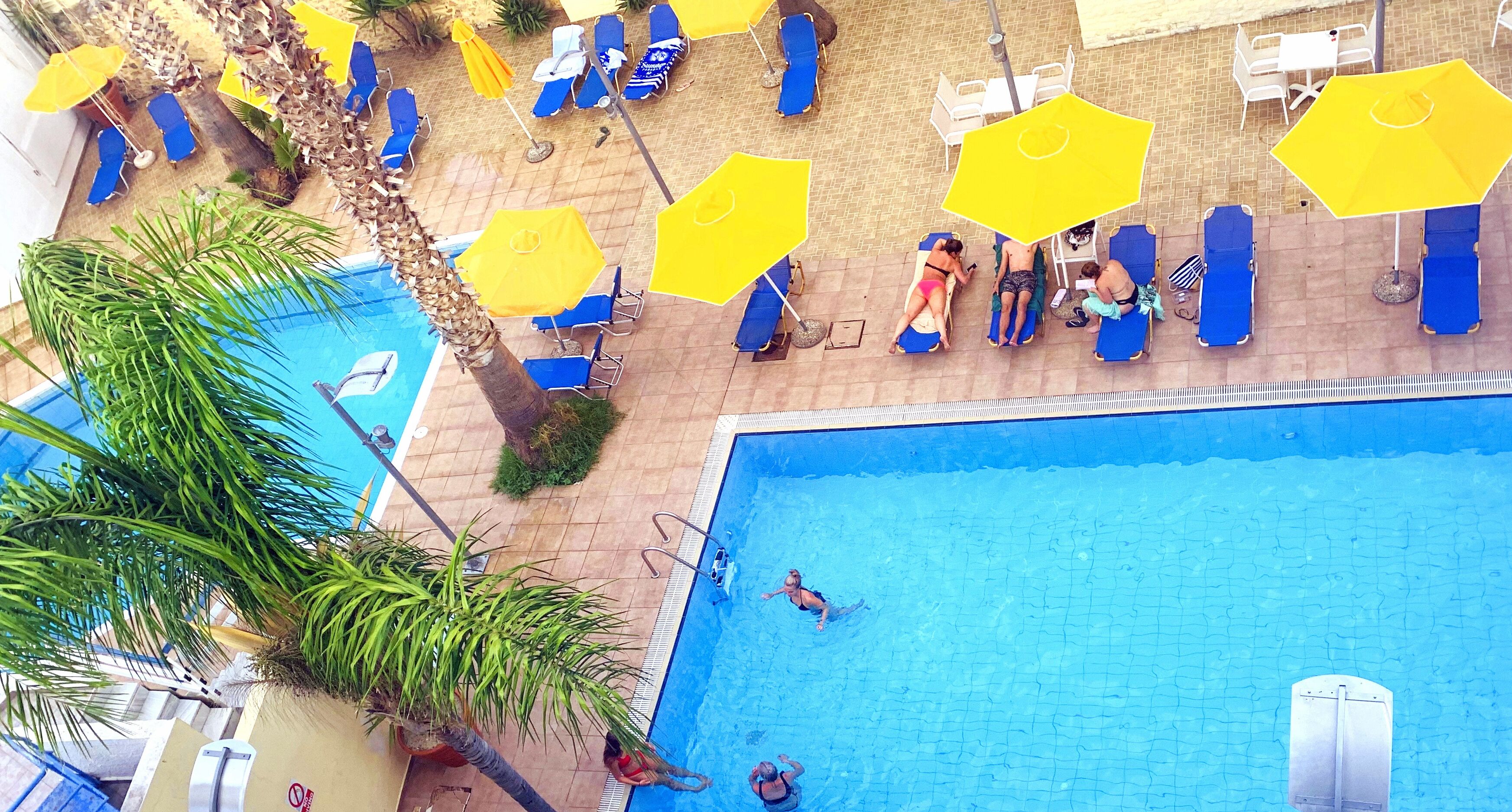 Seasonal outdoor pool, pool umbrellas, pool loungers