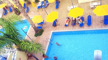 Seasonal outdoor pool, pool umbrellas, pool loungers