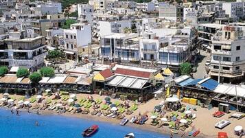 On the beach, sun loungers, beach umbrellas
