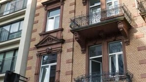 A multi-story building with ornate balconies and large windows. - Hotel Forty Four (Frankfurt)