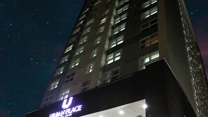 A modern building with a prominent entrance labeled "URBAN PLACE."
