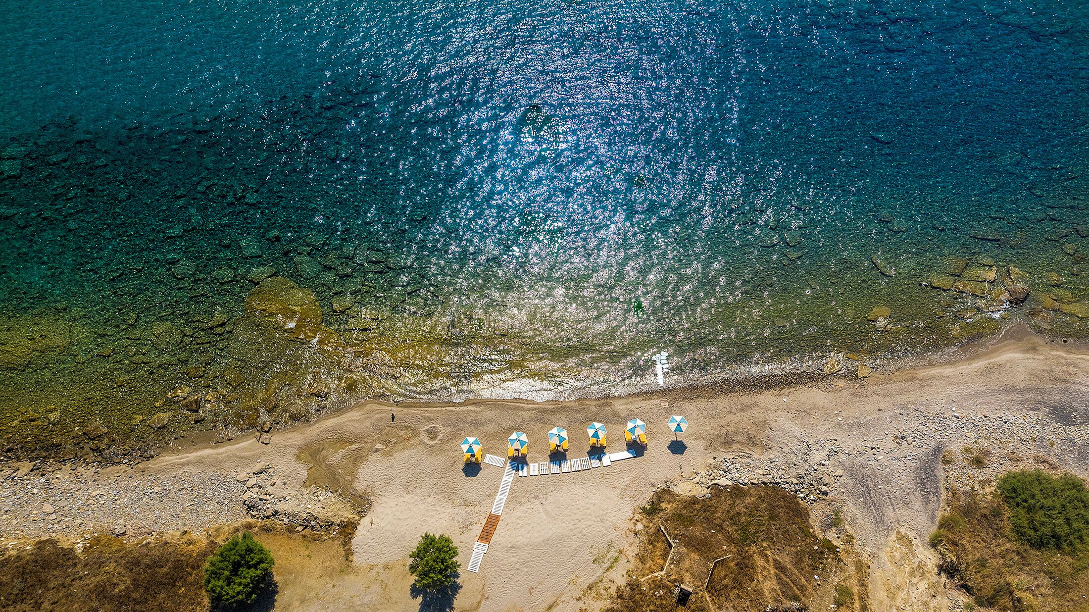 On the beach, sun loungers, beach umbrellas