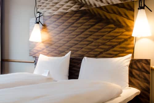 Premium bedding, pillowtop beds, desk, blackout drapes