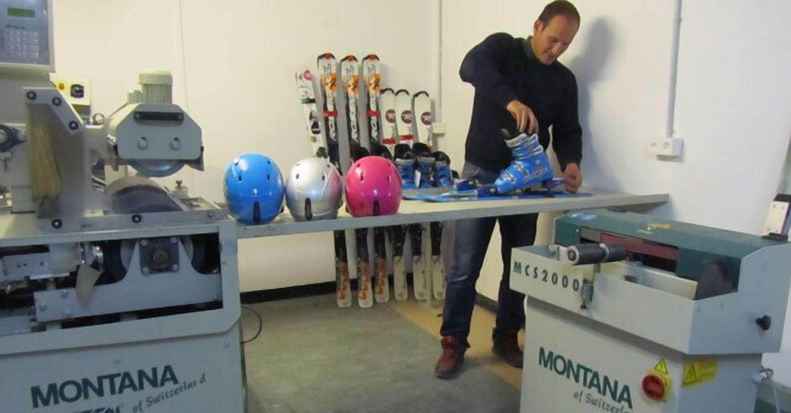 A person working on a table with roller skates and helmets, and a machine labeled 'MONTANA'.