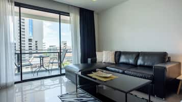 Deluxe Studio Suite, 1 King Bed | Living area | 42-inch flat-screen TV with cable channels, LCD TV, DVD player