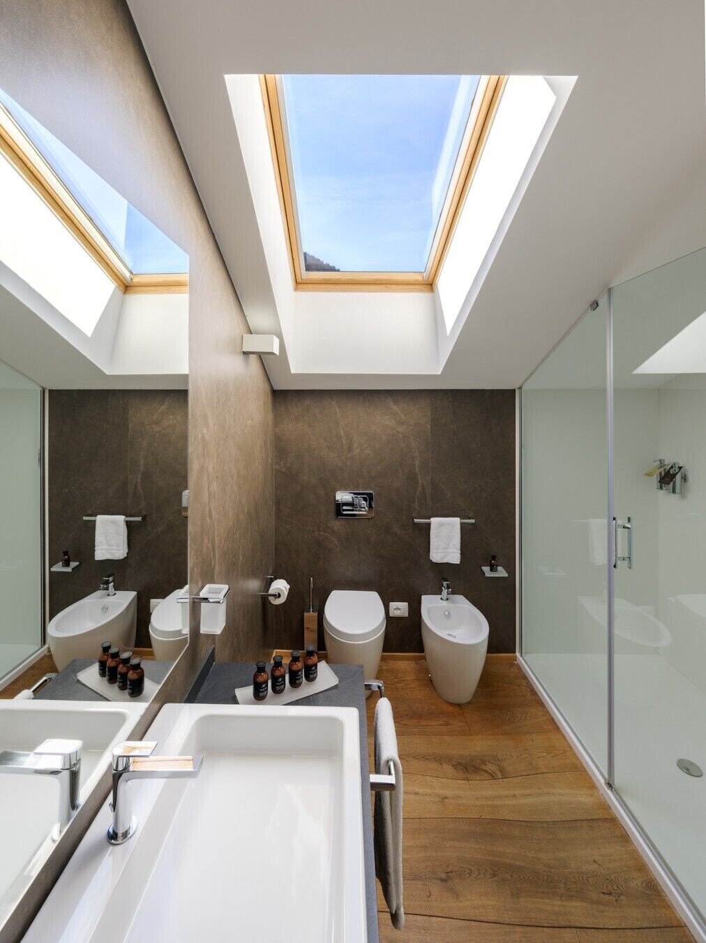 exclusive suite | bathroom | shower, rainfall showerhead, designer toiletries, hair dryer