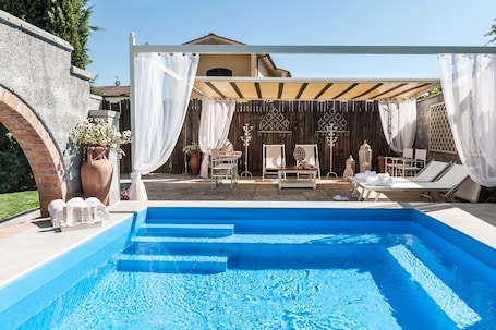 Seasonal outdoor pool, open 9:30 AM to 7:00 PM, sun loungers