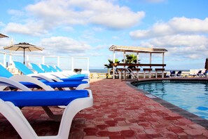 Outdoor pool, open 9:00 AM to 9:00 PM, sun loungers