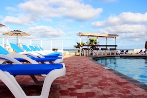 Outdoor pool, open 9:00 AM to 9:00 PM, sun loungers