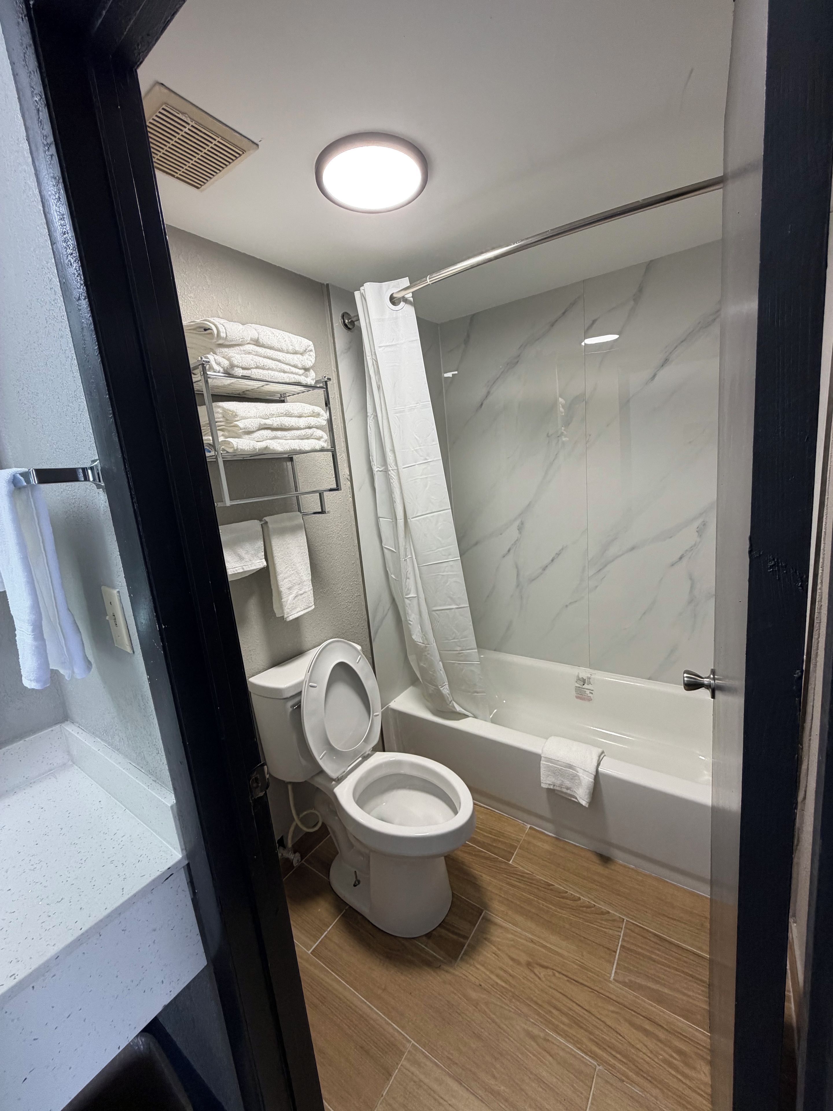 Double Room, 2 Queen Beds, Non Smoking | Bathroom | Combined shower/tub, hair dryer, towels