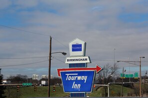 A sign for Tourway Inn with directions to Birmingham.