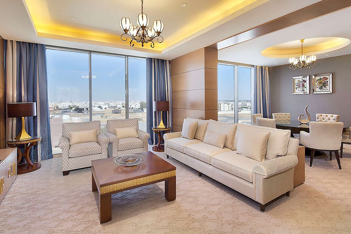 Deluxe Suite, 1 Bedroom | Living area | 42-inch LED TV with cable channels, TV, MP3 dock
