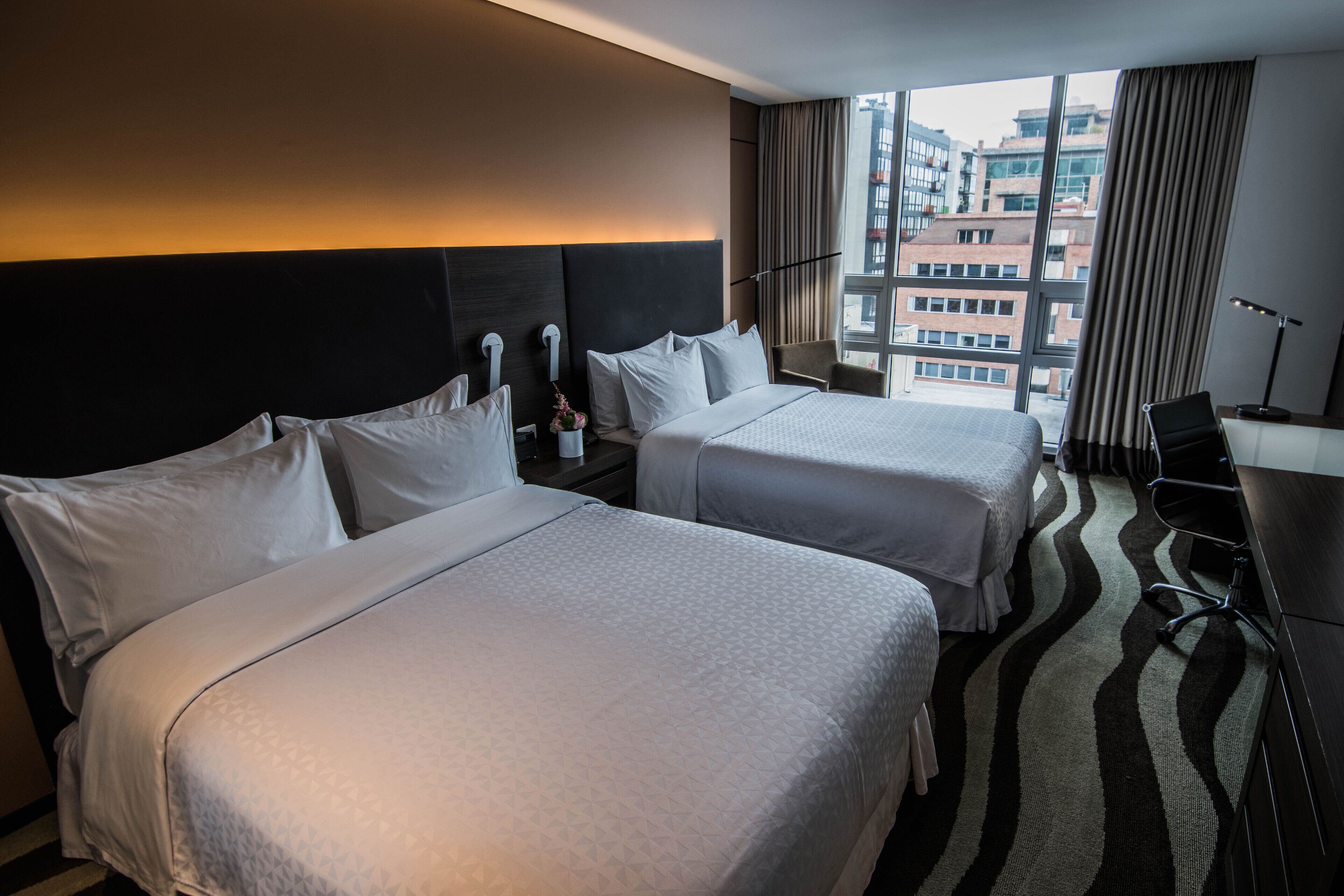 classic room, 2 double beds | premium bedding, minibar, in-room safe, desk