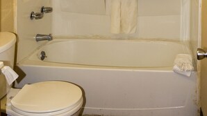 Combined shower/tub, deep soaking tub, hair dryer, towels - Regency Inn (Muskogee)