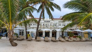 A beachfront hotel with a sandy beach, palm trees, and outdoor seating areas. - Boracay Sands Hotel (Boracay Island)