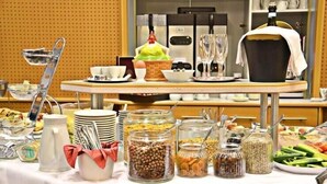A buffet table with various food items and utensils. - Hotel Helenenburg (Bad Gastein)