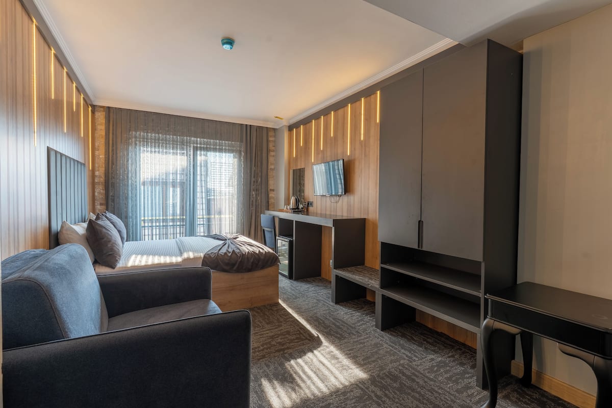 Familie suite | 1 slaapkamer, luxe beddengoed, een minibar, een kluis op de kamer