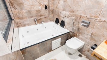 Hair dryer, slippers, bidet, towels