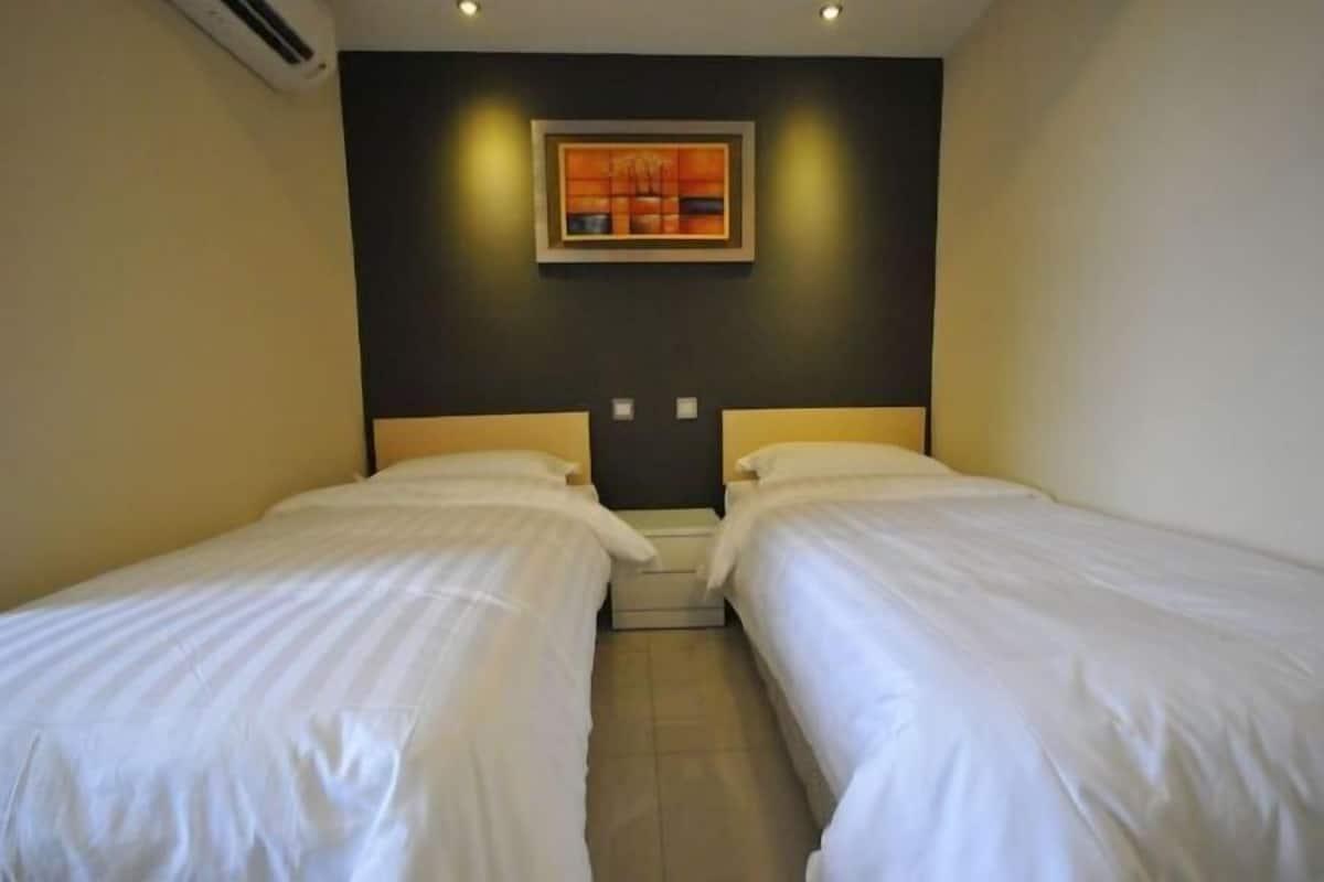 Een kluis op de kamer, gratis wifi, beddengoed
