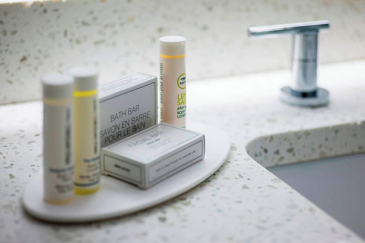 shower, designer toiletries, hair dryer, towels