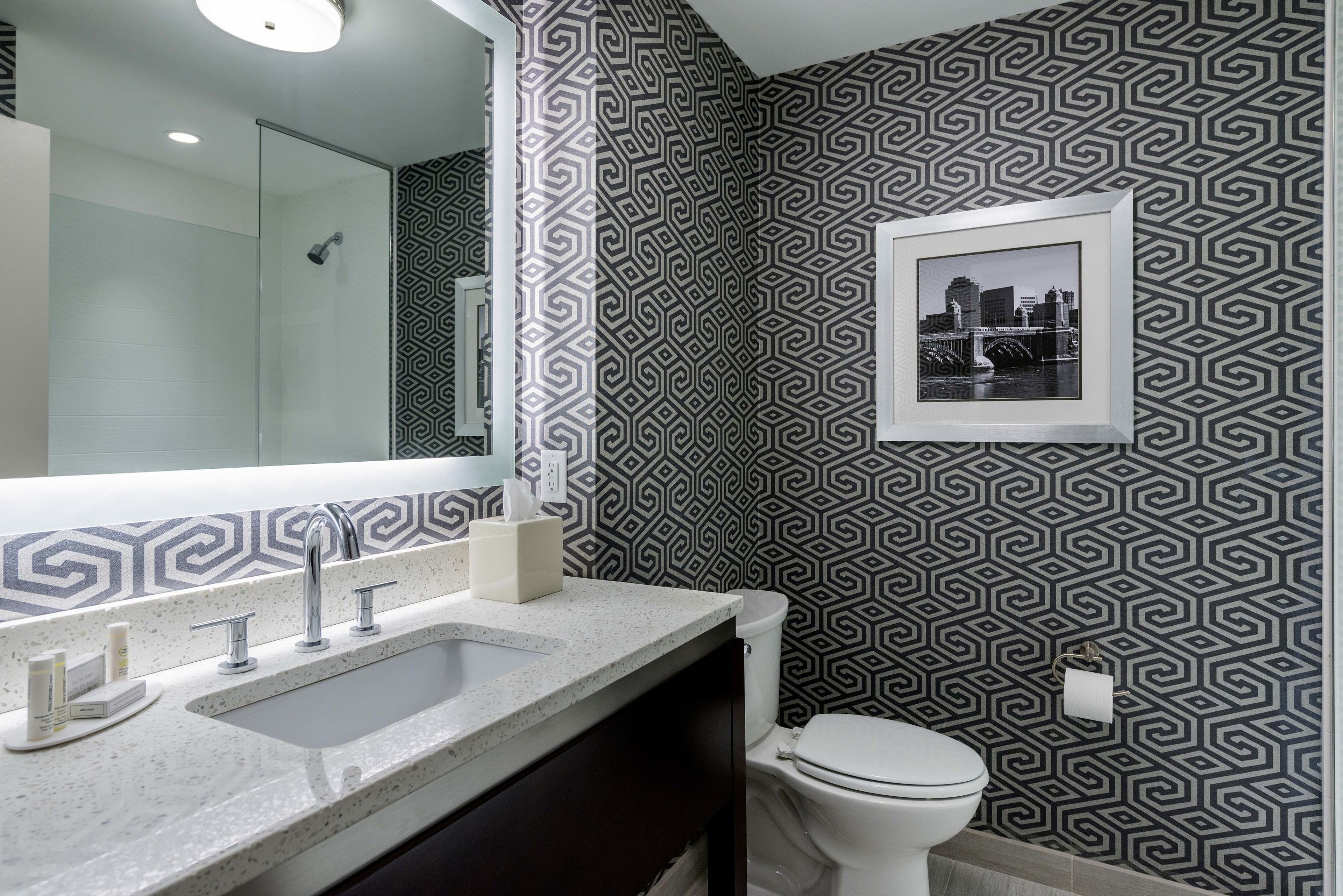 shower, designer toiletries, hair dryer, towels