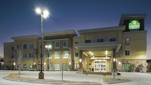 A hotel with a modern design, featuring a prominent entrance and a well-lit facade. - La Quinta Inn & Suites by Wyndham Fort Worth West - I-30 (Fort Worth)