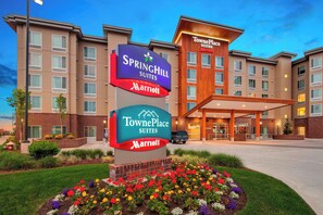 Experience the comfort of TownePlace Suites, featuring a modern design and convenient covered entrance.