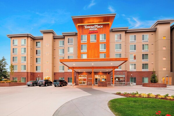 Stylish hotel entrance with a prominent canopy and modern design.