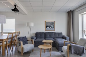 Family Apartment, 2 Bedrooms | Living area | 41-inch Smart TV with cable channels, TV, smart speakers - Hotell Hamnen (Färjestaden)