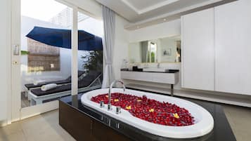 Separate tub and shower, deep soaking tub, free toiletries, bathrobes