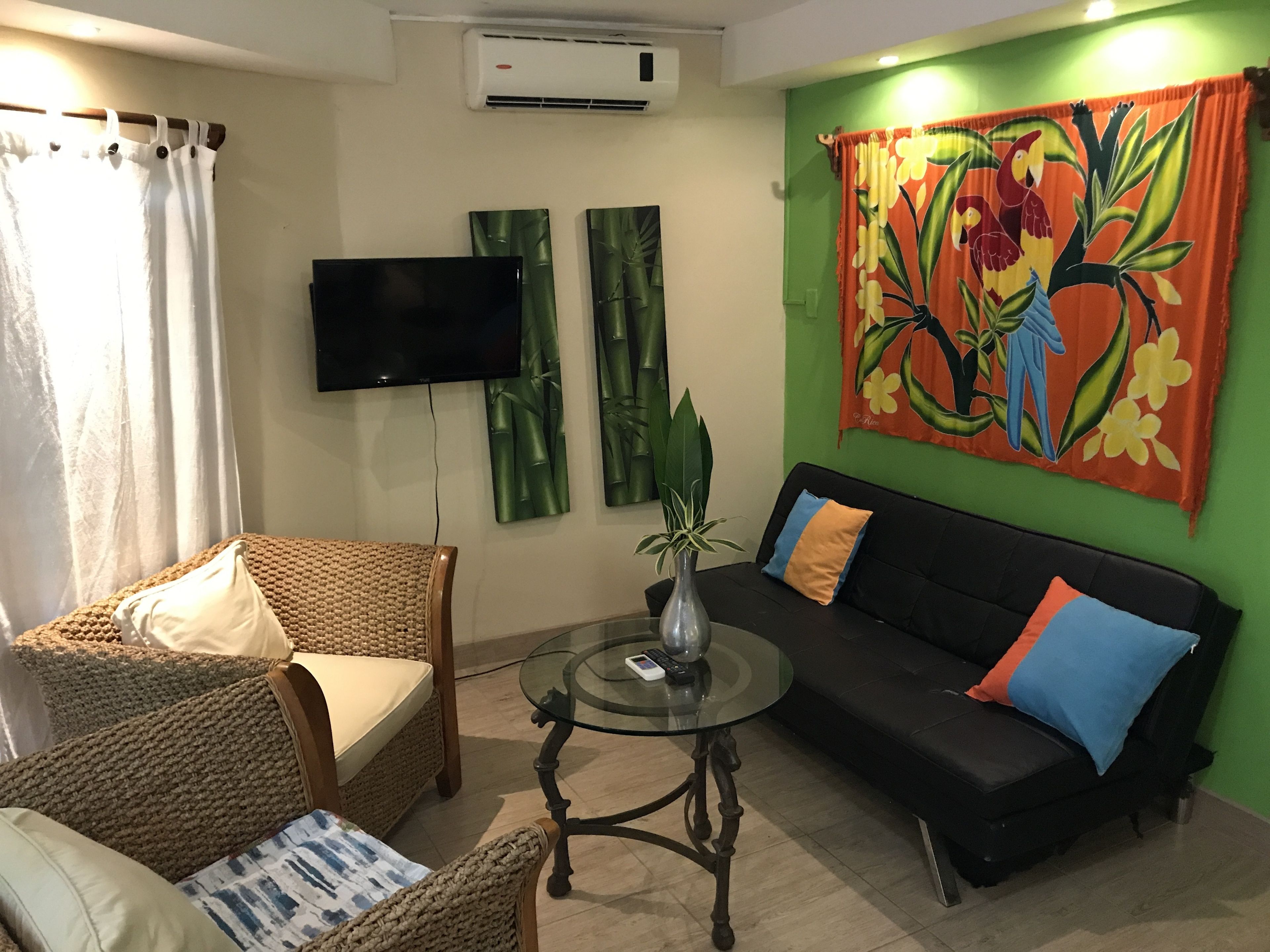 junior garden view room | living area | 30-inch lcd tv with digital channels
