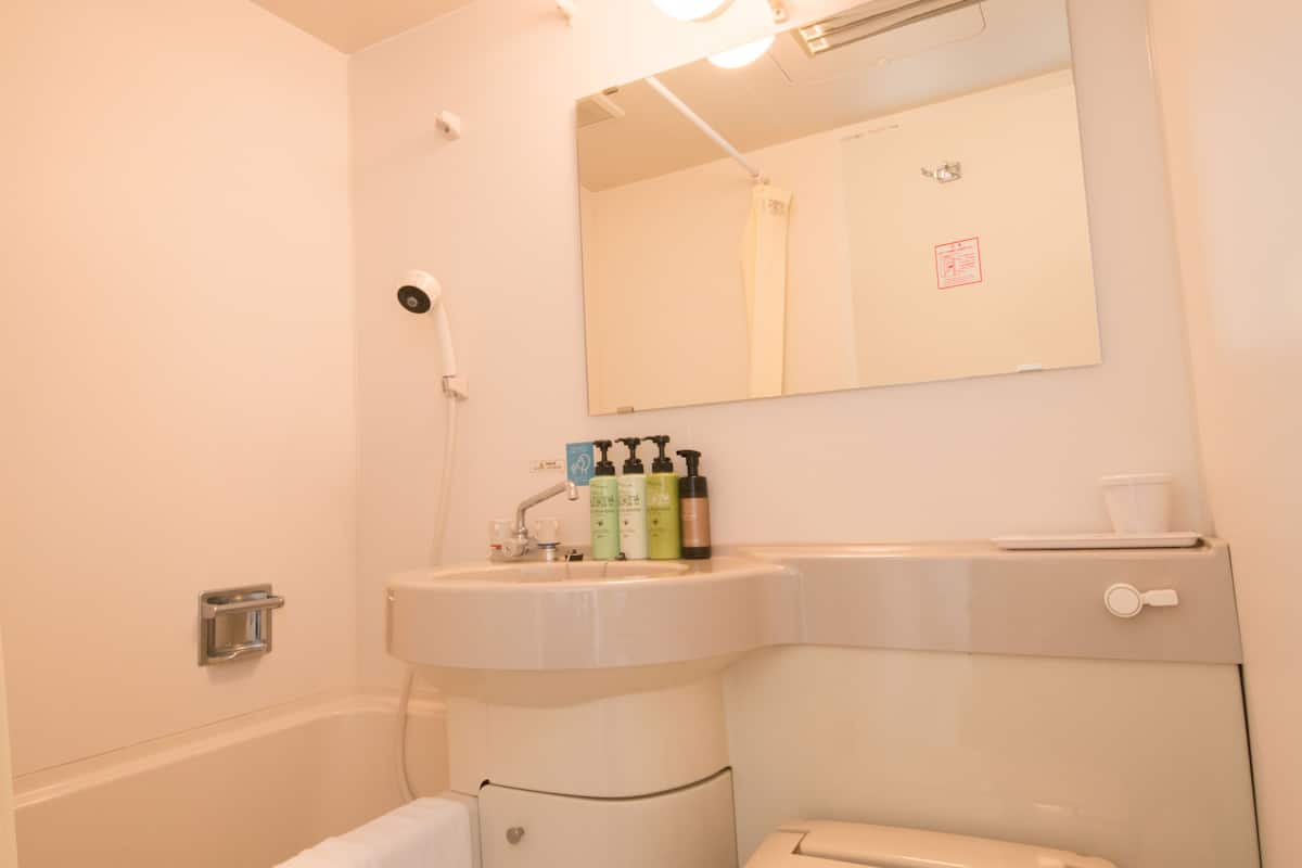 standard single room, smoking | bathroom | separate bathtub and shower, free toiletries, hair dryer, slippers