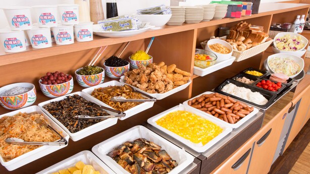 A buffet with various food items including fruits, vegetables, meats, and cheeses. - Ariston Inn Kanda Kitakyushu Airport (Kanda)