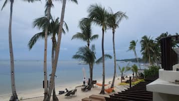 On the beach, white sand, free beach cabanas, sun-loungers