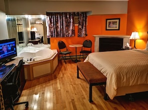 Room, 1 Queen Bed, Hot Tub ( Hardwood Floor & Fireplace) | Desk, iron/ironing board, free WiFi - Motel Tremblant (Mont-Blanc)