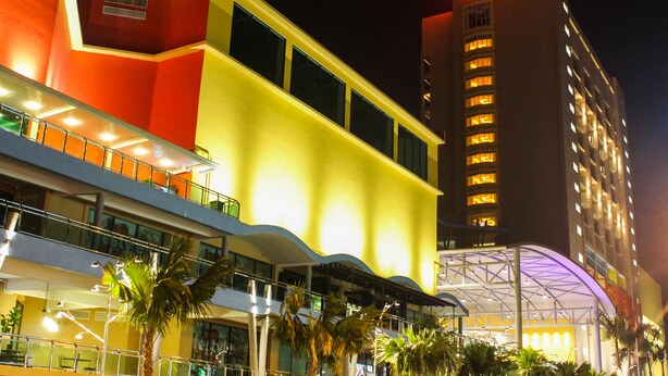 A hotel with a prominent red sign, multiple balconies, and a modern architectural design. - Palm Seremban Hotel (Seremban)