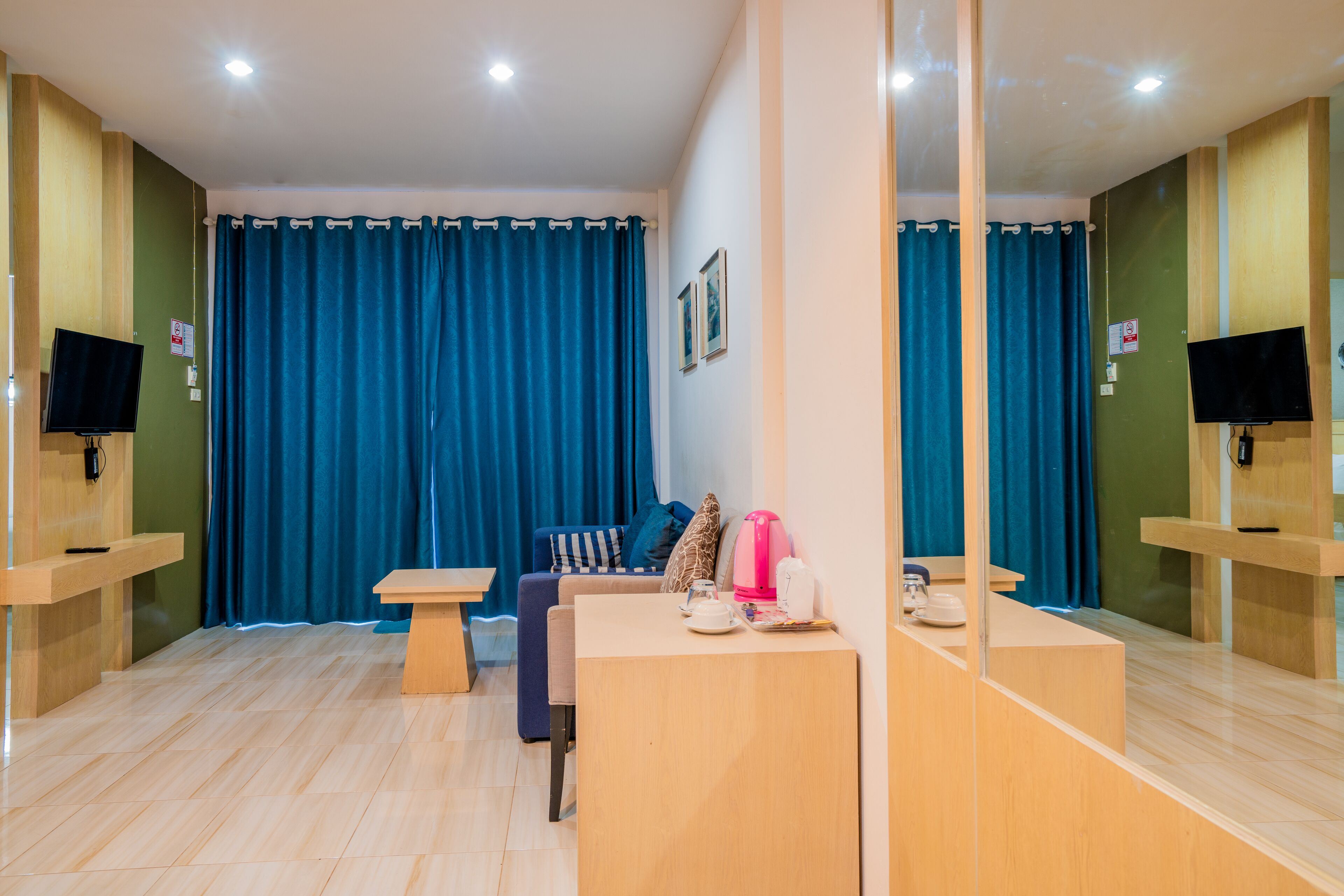 family suite | living area | 32-inch flat-screen tv with cable channels, tv