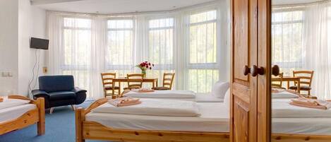 Hypo-allergenic bedding, desk, blackout drapes, soundproofing