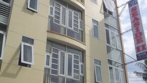 A multi-story hotel with a sign indicating it is a hotel. - Seaside Hotel 2 (Nha Trang)