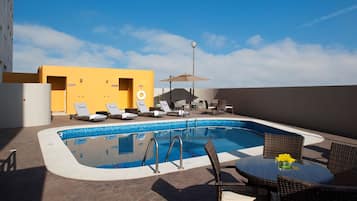 Outdoor pool, open 8:00 AM to 9:00 PM, pool umbrellas, pool loungers