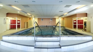A large indoor swimming pool with steps leading into it, surrounded by red lockers and a tiled floor. - Noemys Castor & Pollux (Risoul)