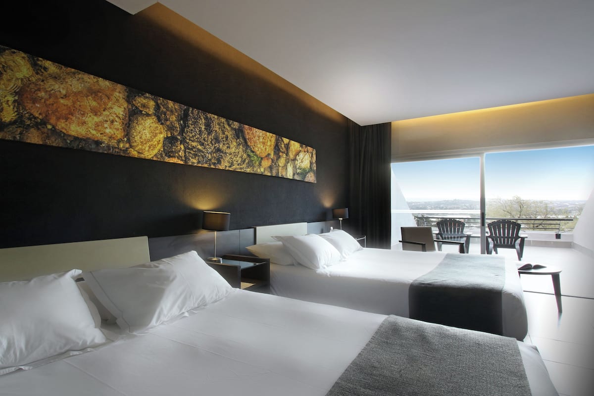 Premium bedding, pillow-top beds, minibar, in-room safe