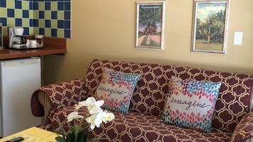 Junior Suite, 1 Bed with Sofa Bed | Living area | 32-inch flat-screen TV with cable channels, TV