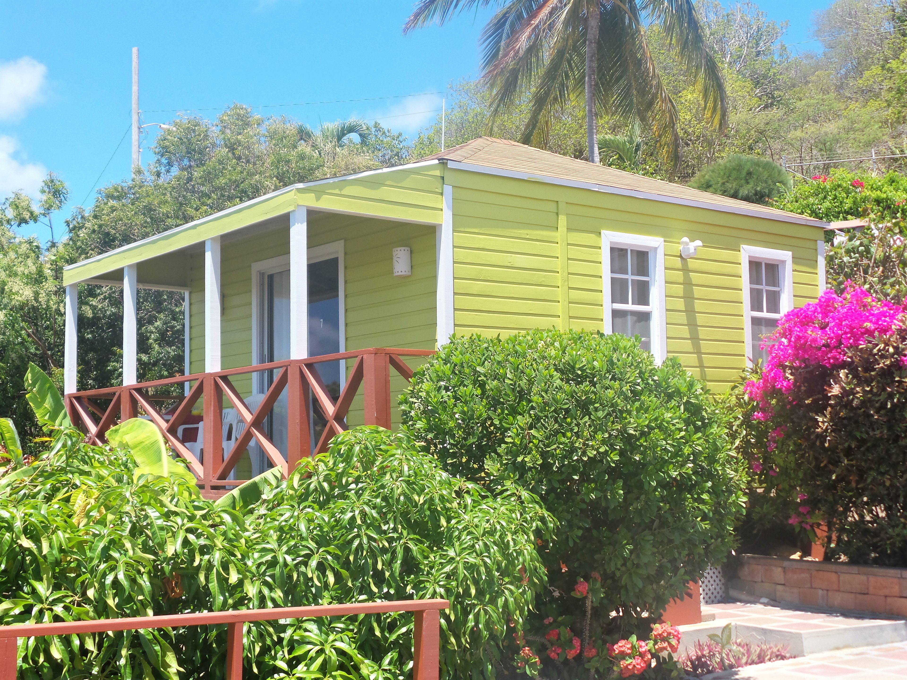 A small, single-story building with a porch and a small window.