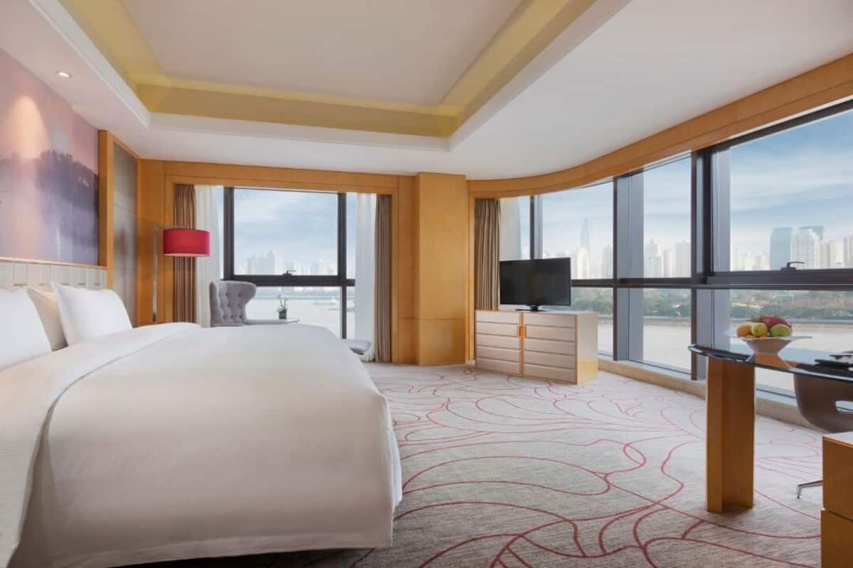Premium Room, 1 King Bed, River View | Minibar, in-room safe, desk, laptop workspace