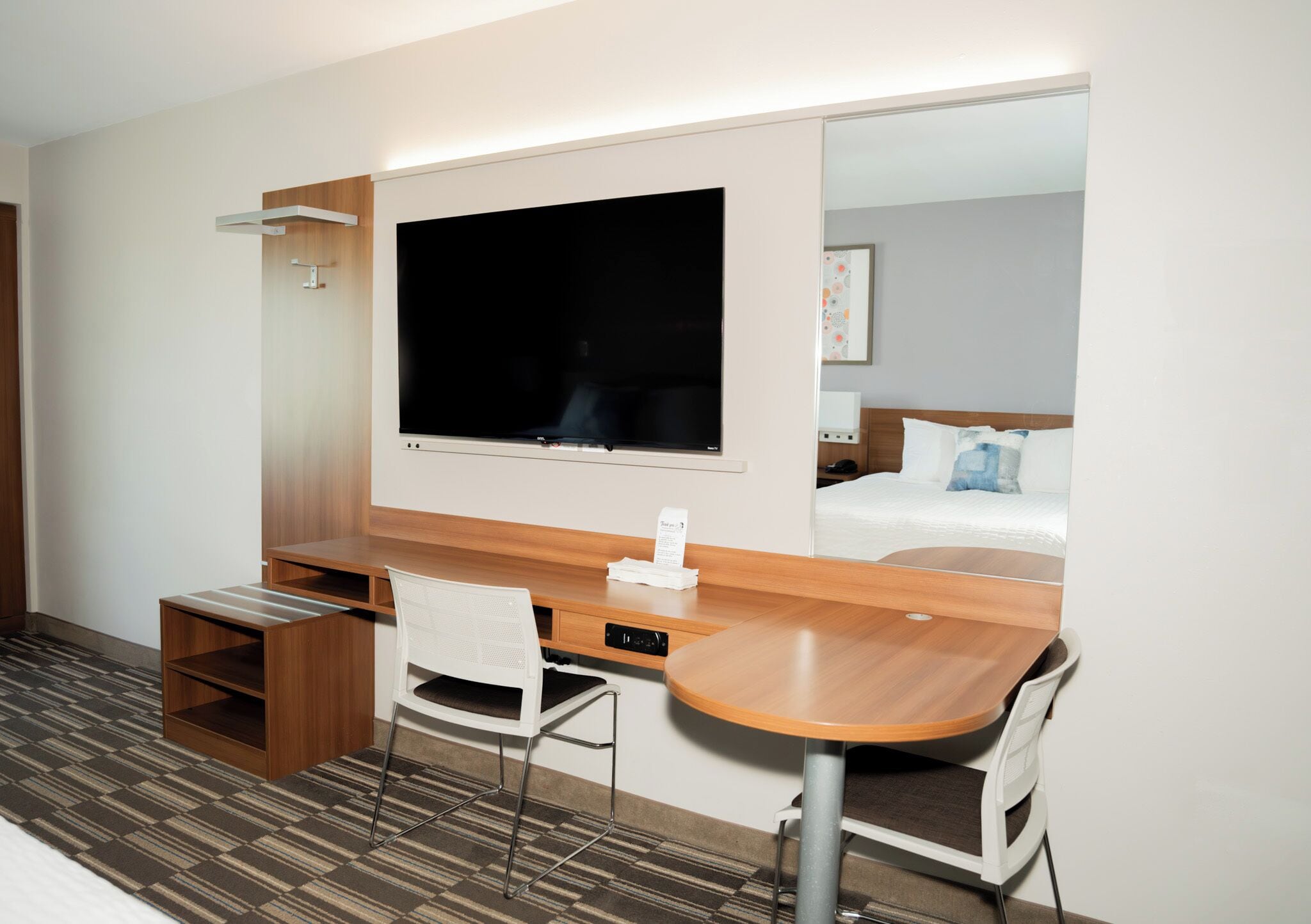 premium bedding, pillow-top beds, desk, laptop workspace